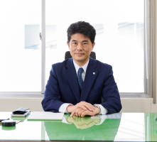 専務取締役 足立 正伸
